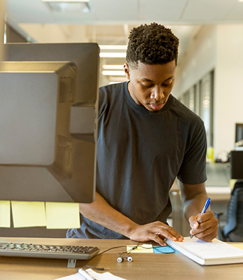 An intern works at a desk.